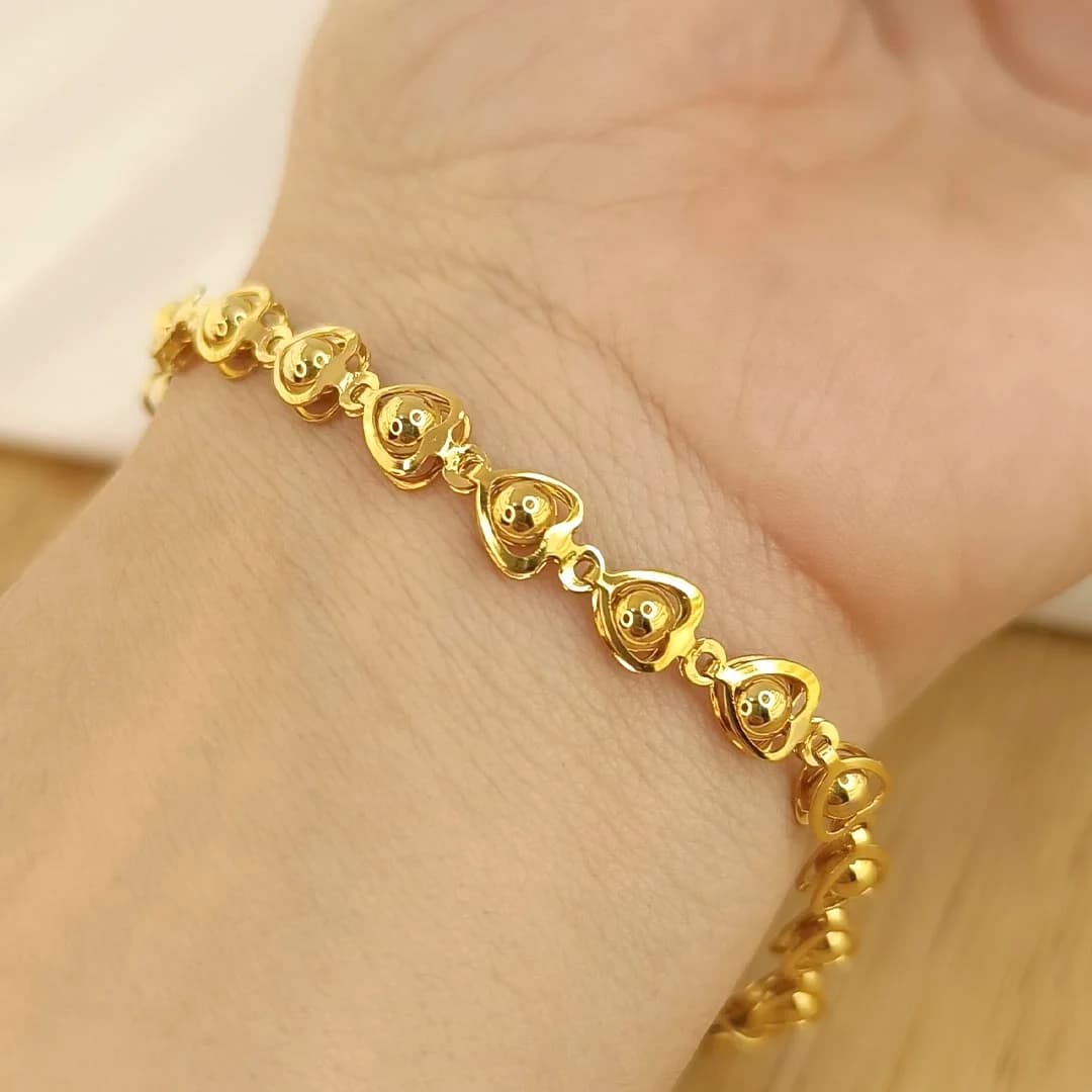 Pulsera Dorada dije Corazones con bolitas unidos